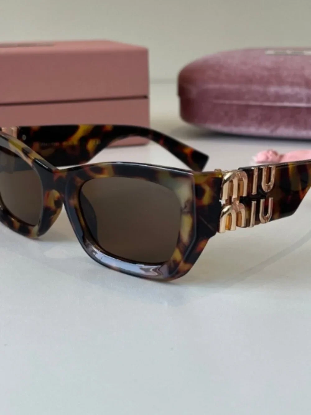 Miu Miu. chic vintage‑inspired